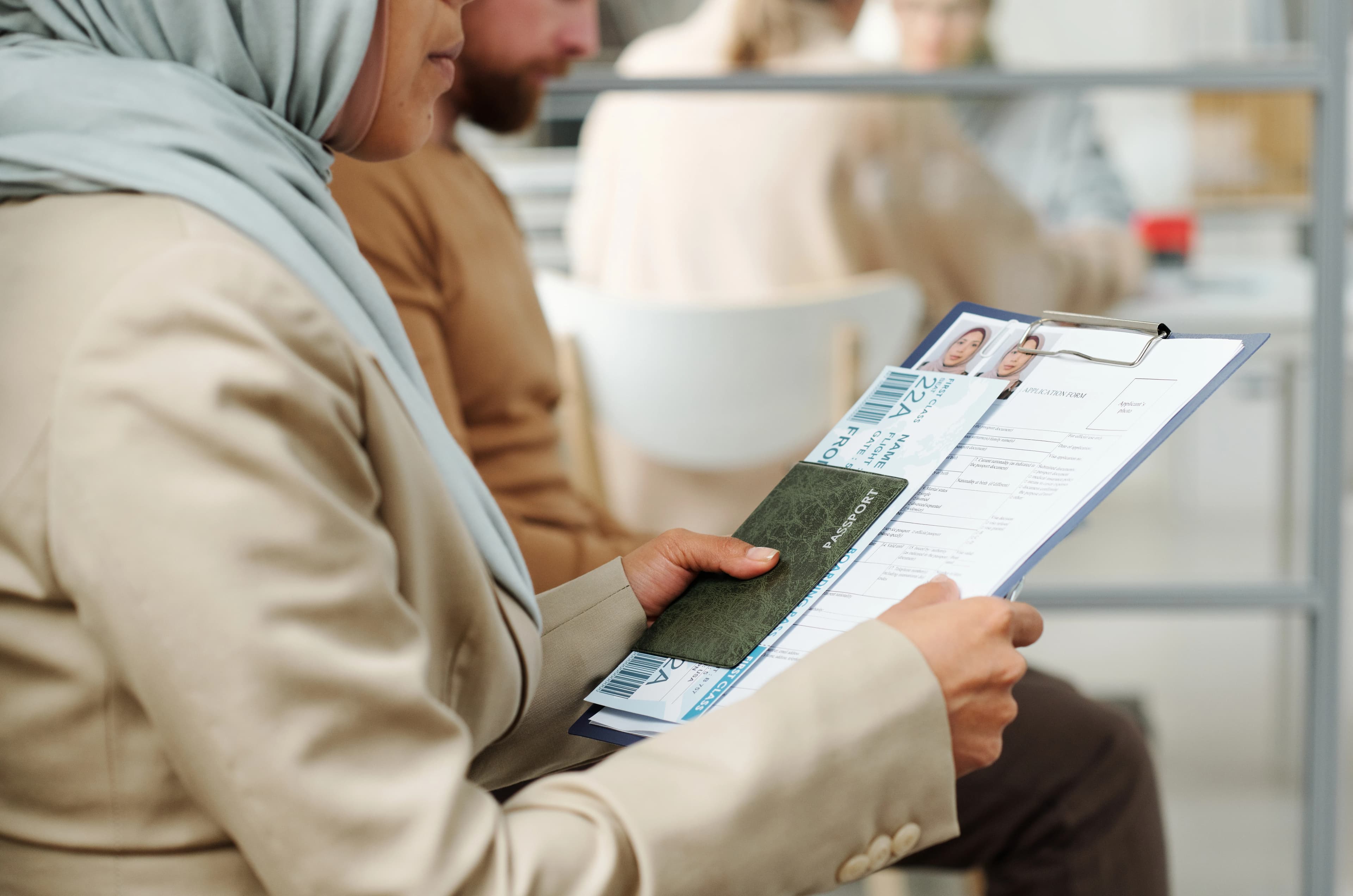 a woman holding her approved work visa papers
